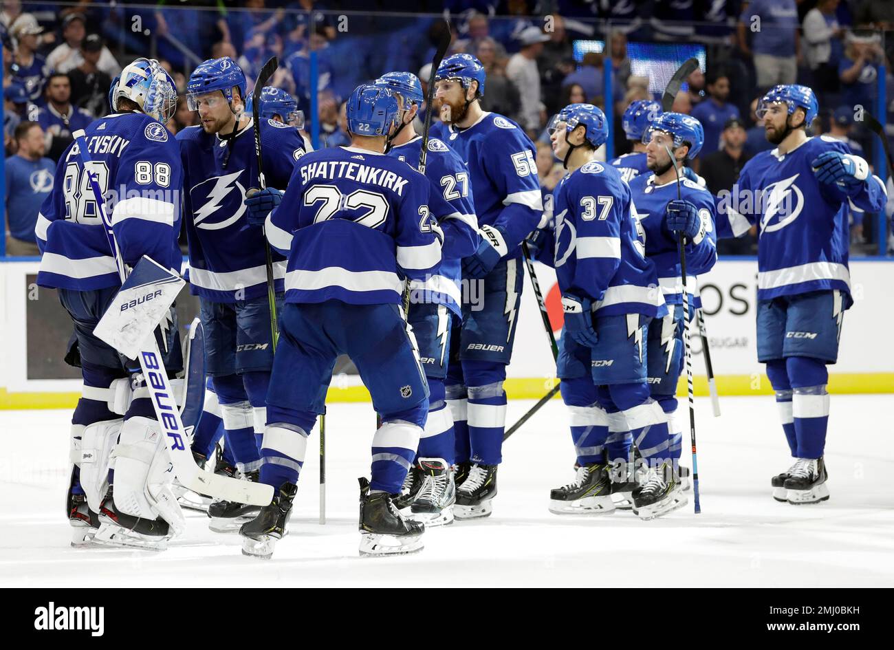 Tampa Bay Lightning players line up to celebrate with goaltender Andrei