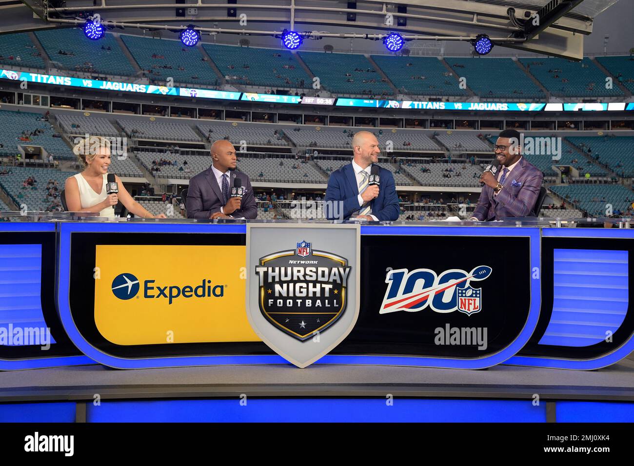 The NFL Network's Thursday Night Football television team of Colleen Wolfe,  left, Steve Smith, second from left, Joe Thomas and Michael Irvin, right,  broadcast from their set before an NFL football game