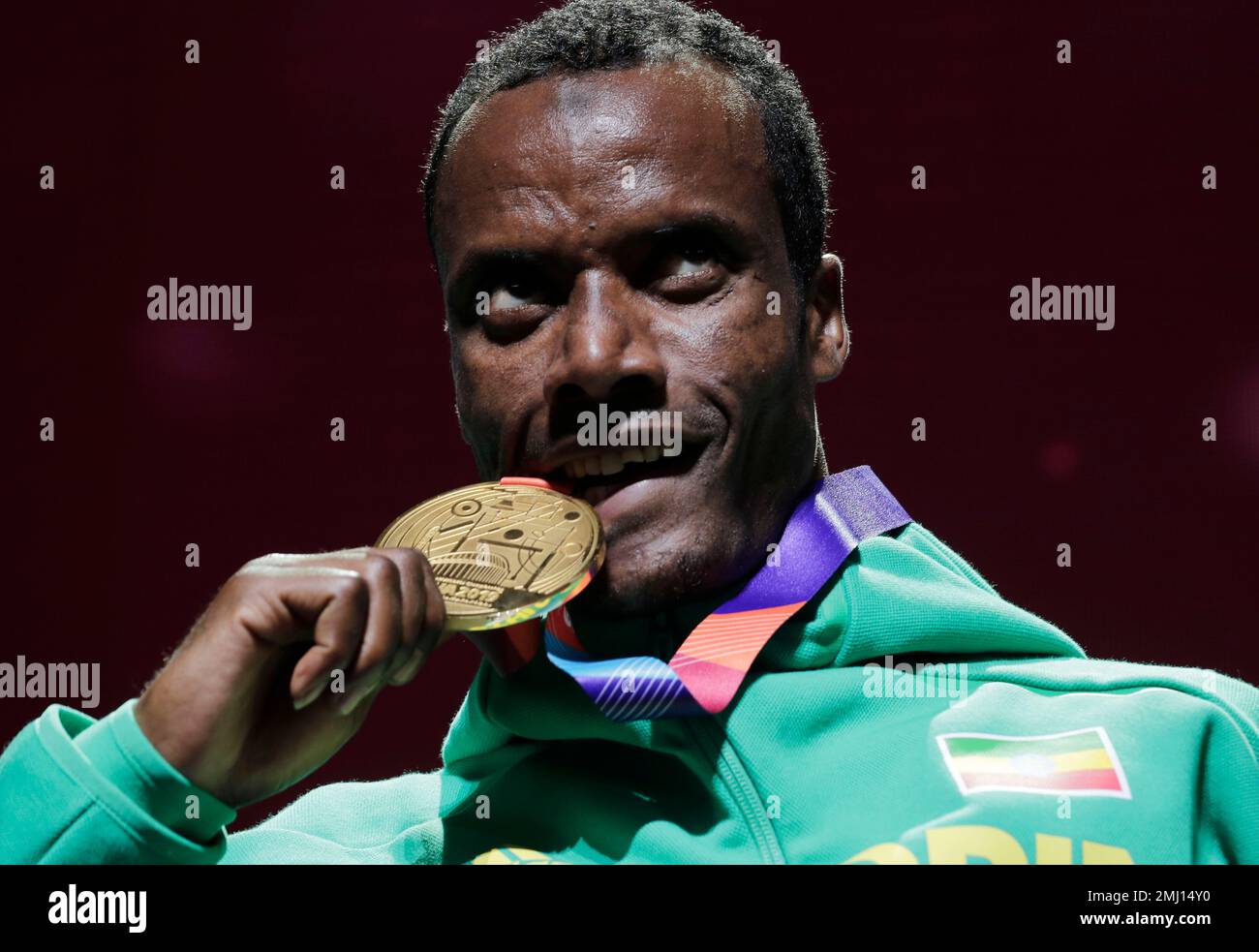 Gold medalist Muktar Edris, of Ethiopia, poses during the medal