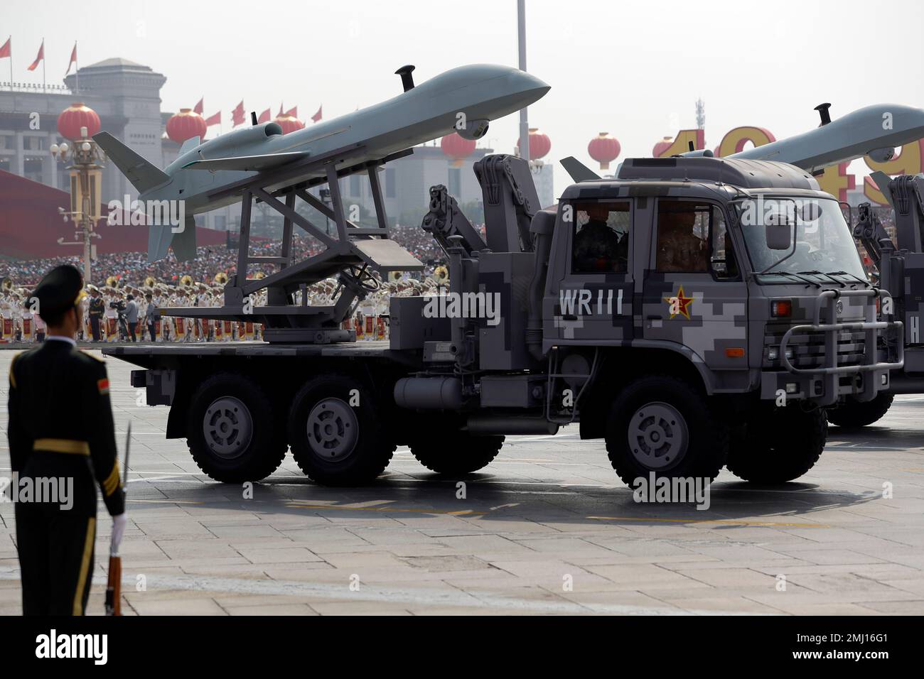 A Chinese military truck carrying an aerial vehicle rolls during a parade to commemorate the 70th anniversary of the founding of Communist China in Beijing, Tuesday, Oct. 1, 2019. Trucks carrying weapons including a nuclear-armed missile designed to evade U.S. defenses rumbled through Beijing as the Communist Party celebrated its 70th anniversary in power with a parade Tuesday that showcased China's ambition as a rising global force. (AP Photo/Mark Schiefelbein) Stock Photo