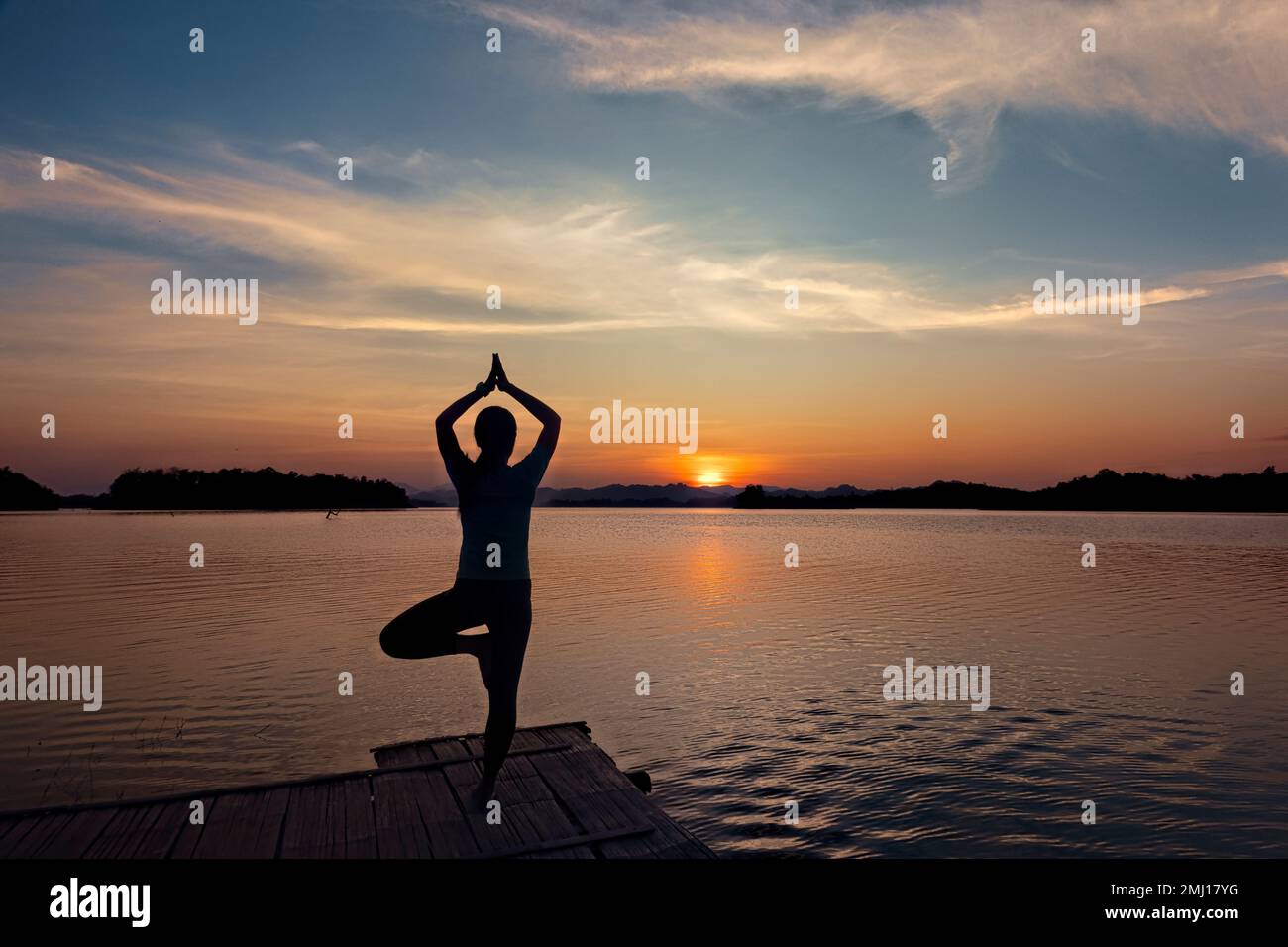 Enjoying sunset along the Vajiralongkorn Reservoir, Khao Laem National Park, Kanchanaburi, Thailand Stock Photo