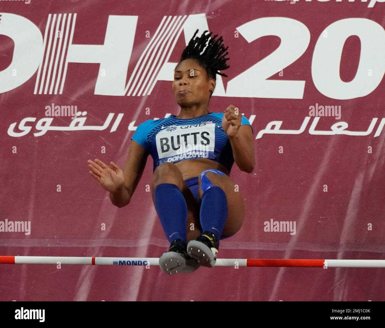 Tynita Butts, of the United States, clears the bar during the women's