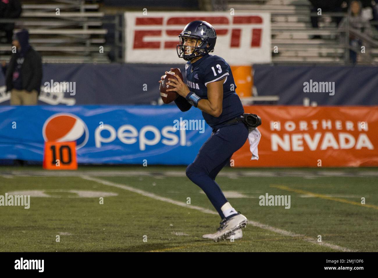 Nevada quarterback Cristian Solano (13) drops back to pass against Hawaii  in the second half of an NCAA college football game in Reno, Nev.,  Saturday, Sept. 28, 2019. (AP Photo/Tom R. Smedes