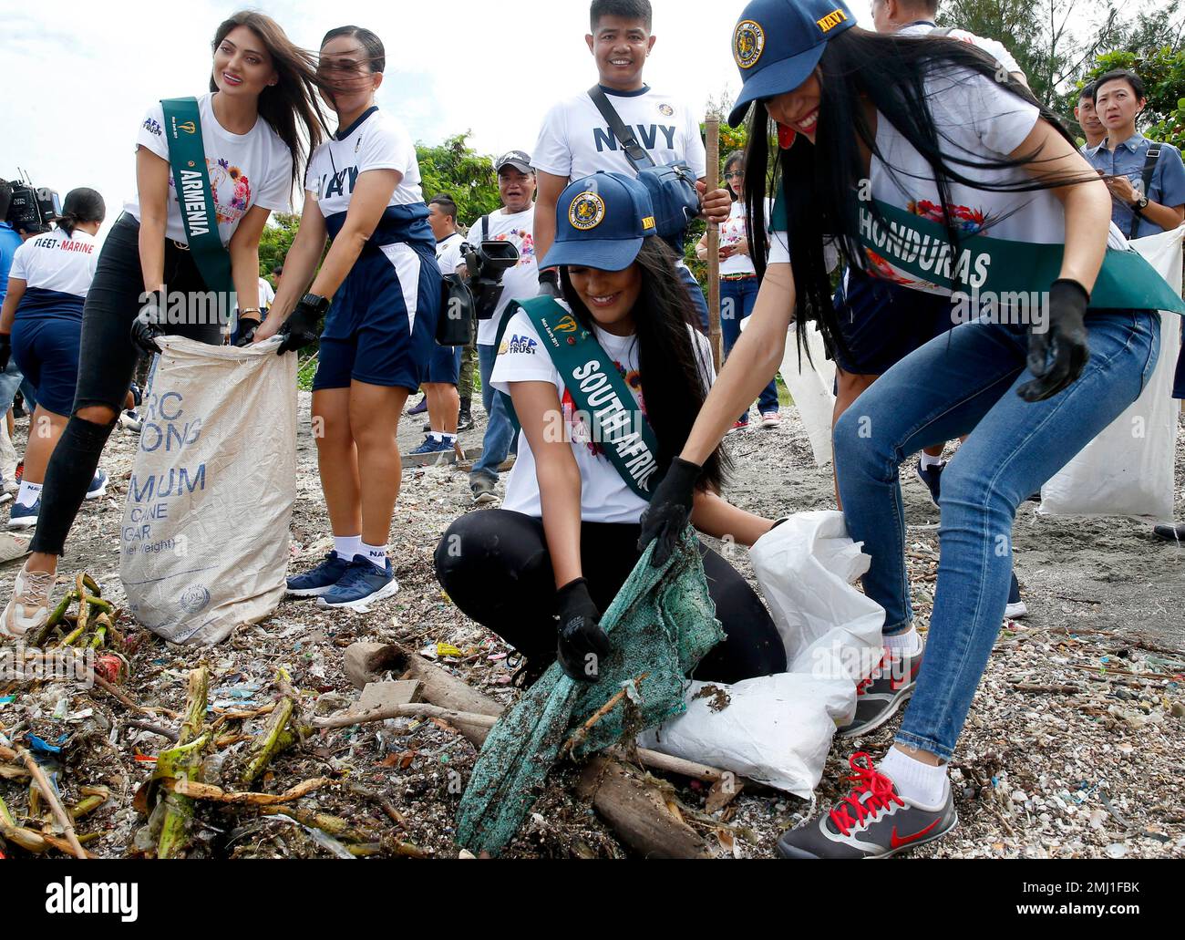 Rita Velasquez, right, of Honduras and Nazia Wadee, center, of South ...
