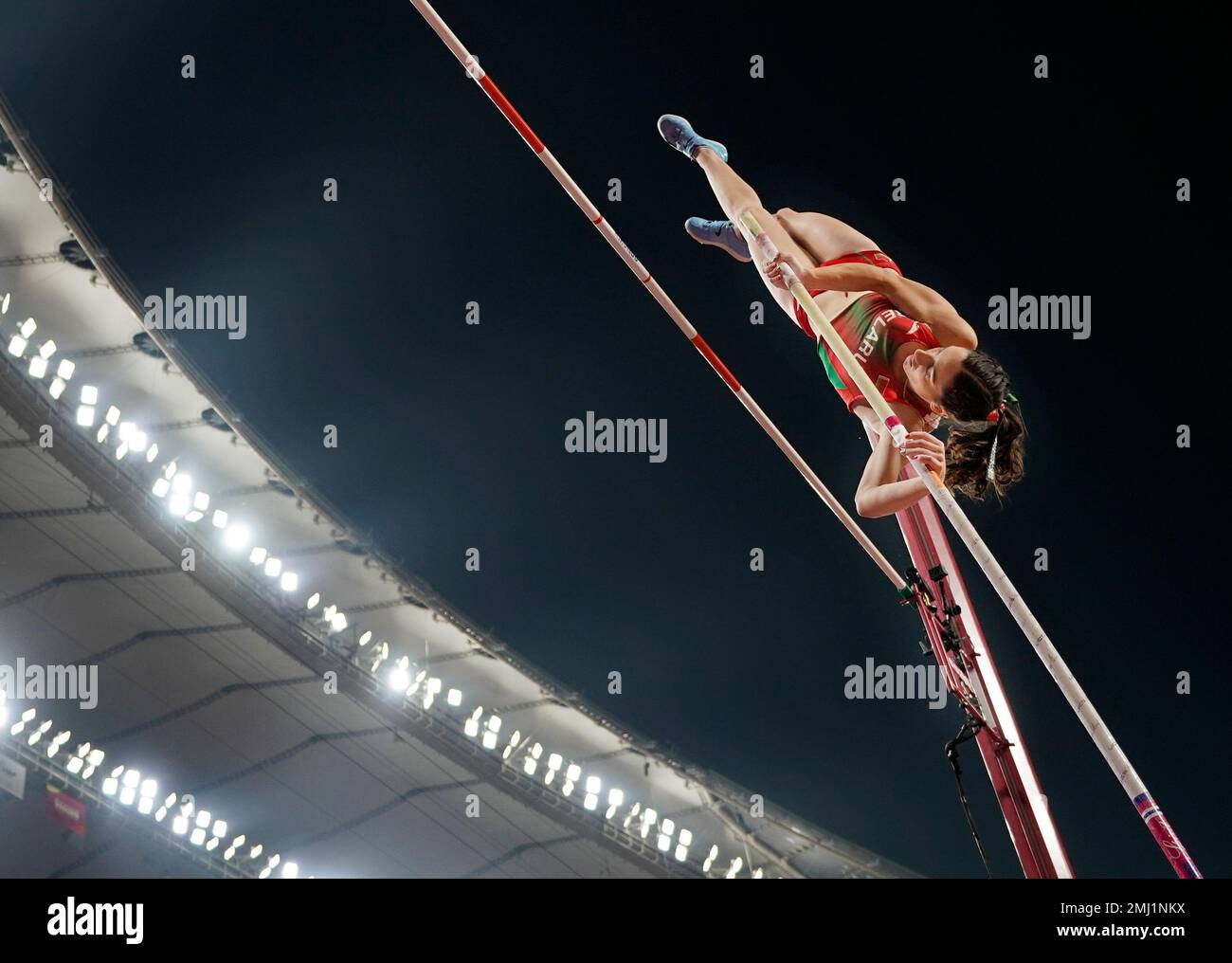 Iryna Zhuk, of Belarus, competes in the women's pole vault final at the
