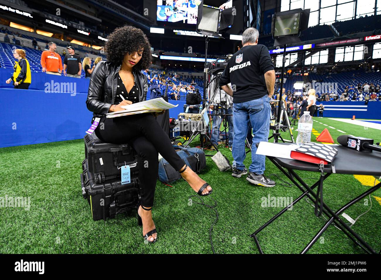 MJ Acosta of the NFL Network works before before an NFL football game  between the Oakland Raiders and the Indianapolis Colts in Indianapolis,  Sunday, Sept. 29, 2019. (AP Photo/Doug McSchooler Stock Photo 