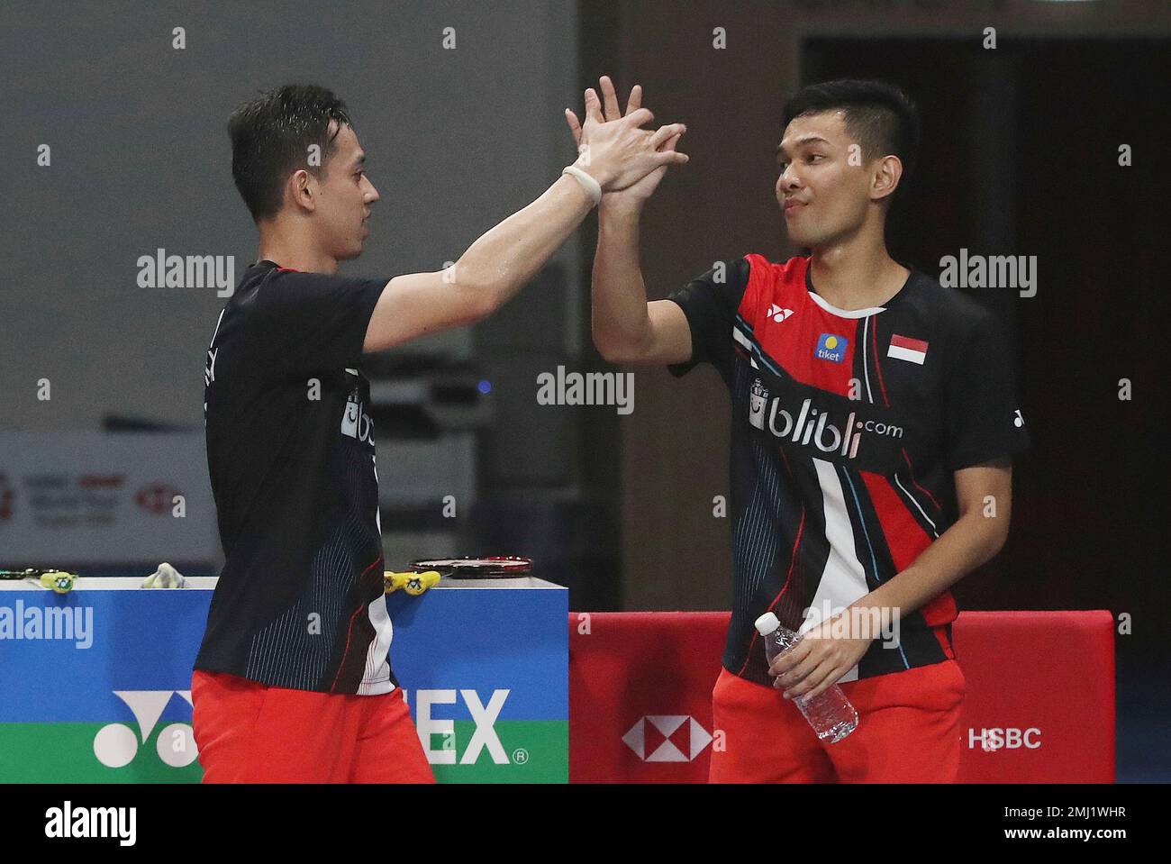 Indonesias Muhammad Rian Ardianto and Fajar Alfian, left, celebrate after winning against Japans Takeshi Kamura and Keigo Sonoda during the mens doubles final match at the Korea Open Badminton in Seoul, South
