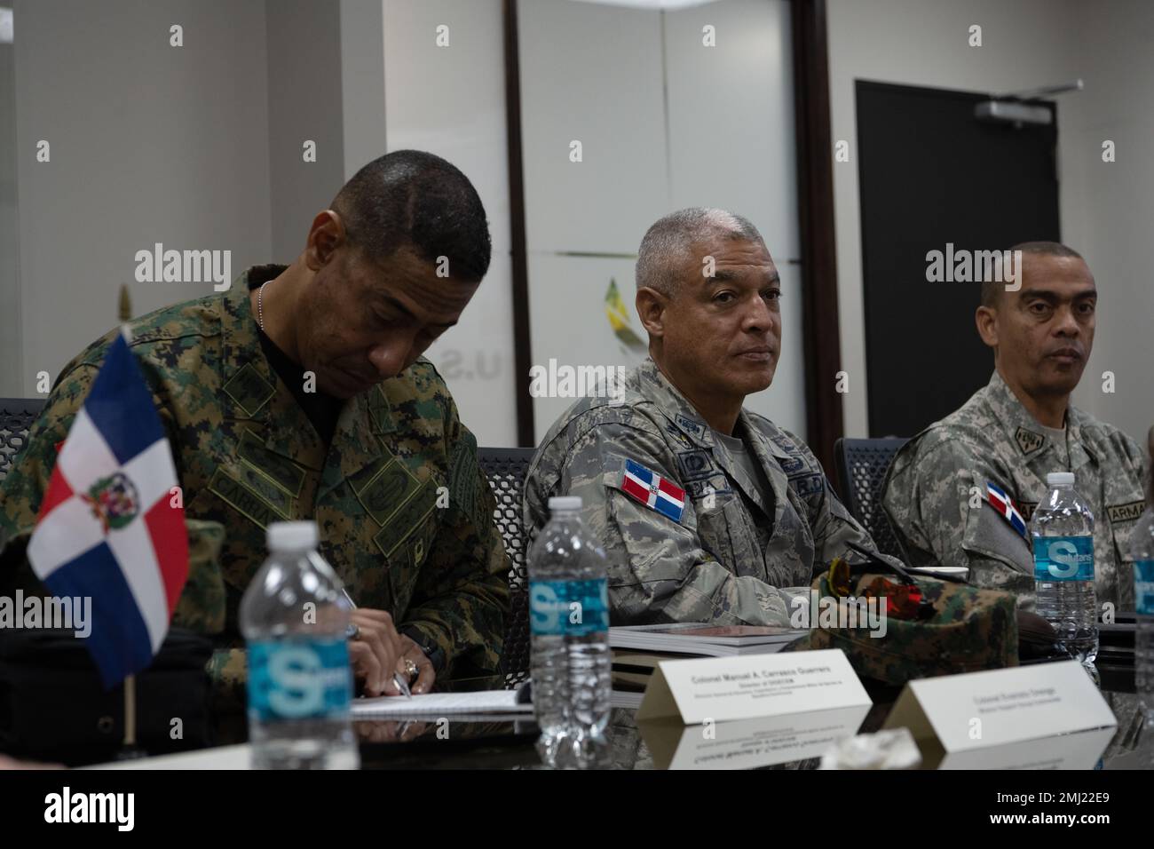 From left, Dominican Republic army Col. Manuel Carrasco, director of DIGECEM, Dominican Republic air force Col. Julio Garcia, director of ESFODECAM and Dominican Republic navy Capt. Eddy Martinez, navy school director, attend a State Partnership Program meeting with leadership of the Puerto Rico Air National Guard at Muñiz Air National Guard Base, Carolina, Puerto Rico, Aug. 24, 2022. The SPP meeting served to strengthen relationships between the 156th Wing and the Dominican Republic armed forces. Stock Photo