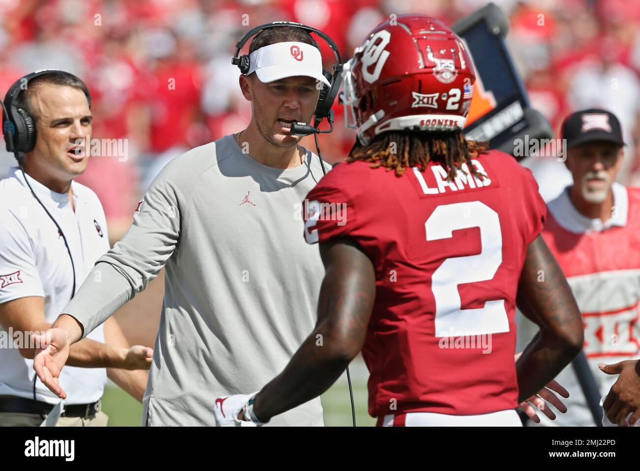 Oklahoma head coach Lincoln Riley greets wide receiver CeeDee Lamb (2