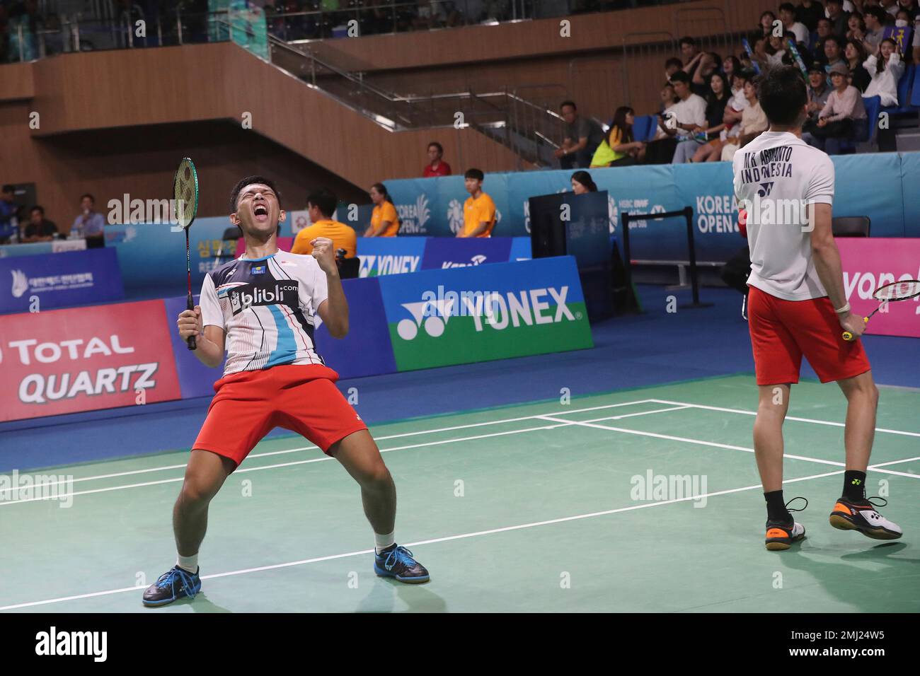 Indonesias Muhammad Fajar Alfian, left , and his teammate Rian Ardianto celebrate after winning against Chinas Li Jun Hui and Liu You Chen during the mens doubles semi-final match at the Korea