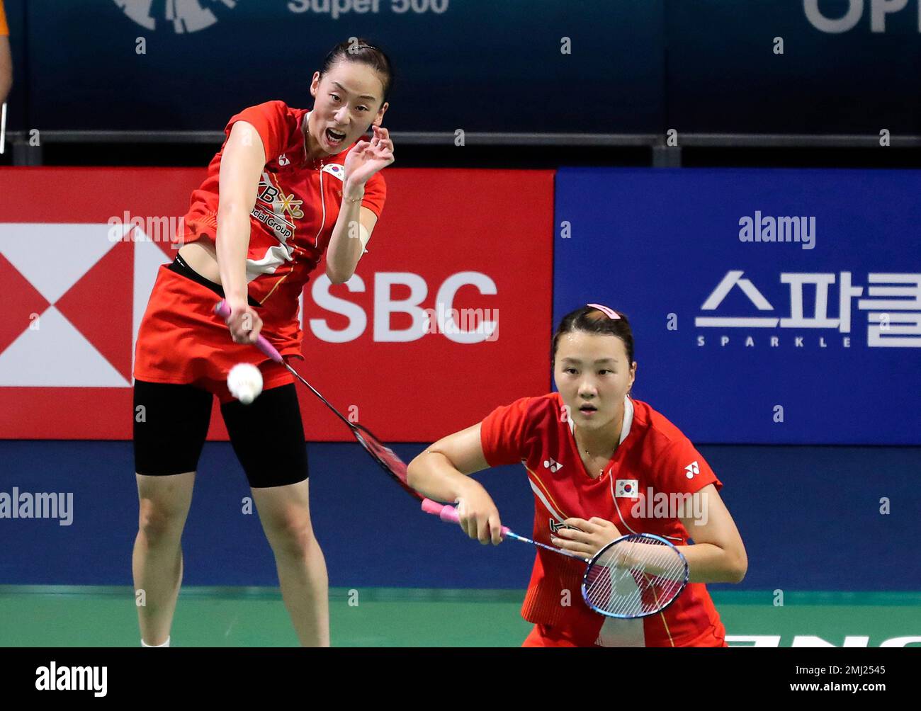 South Koreas Lee So-hee, left, returns a shot as her teammate Shin Seun-chan stands during the womens doubles semi-final match against Japans Nami Matsuyama and Chiharu Shida at the Korea Open Badminton