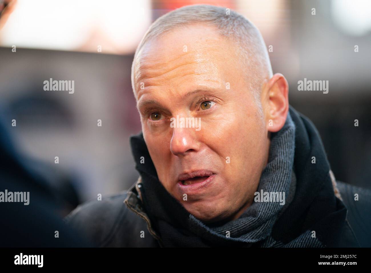 Robert Rinder talks to the media Piccadilly Circus, central London, as a selection of entries from the Holocaust Memorial Trust's (Extra)Ordinary Portraits competition, as well as new photographs of genocide survivors taken by photographer Rankin, are shown on the video screens, to mark Holocaust Memorial Day. Picture date: Friday January 27, 2023. Stock Photo