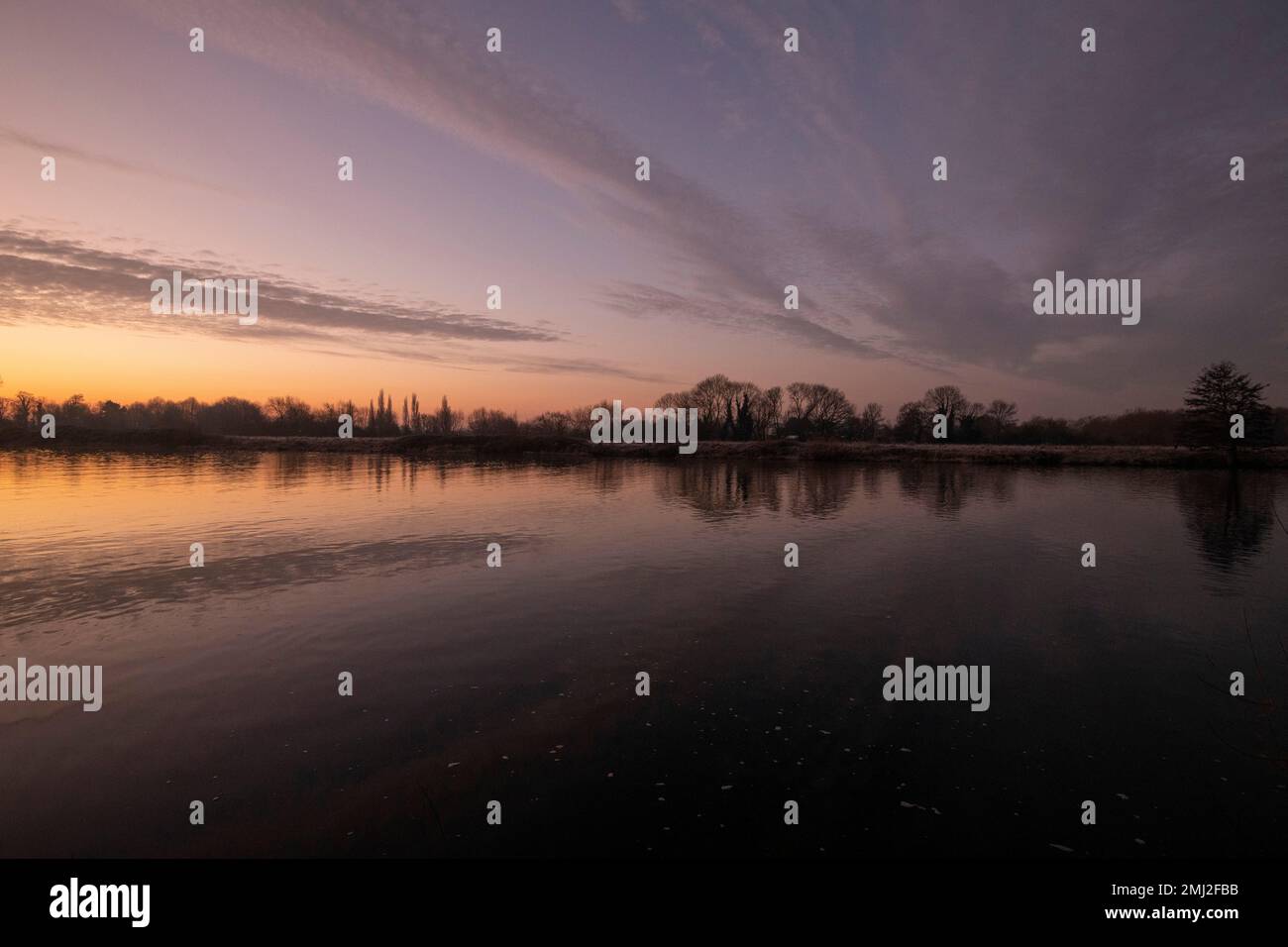 Sunrise reflections on the River Trent at Colwick Park, Nottingham Nottinghamshire England UK