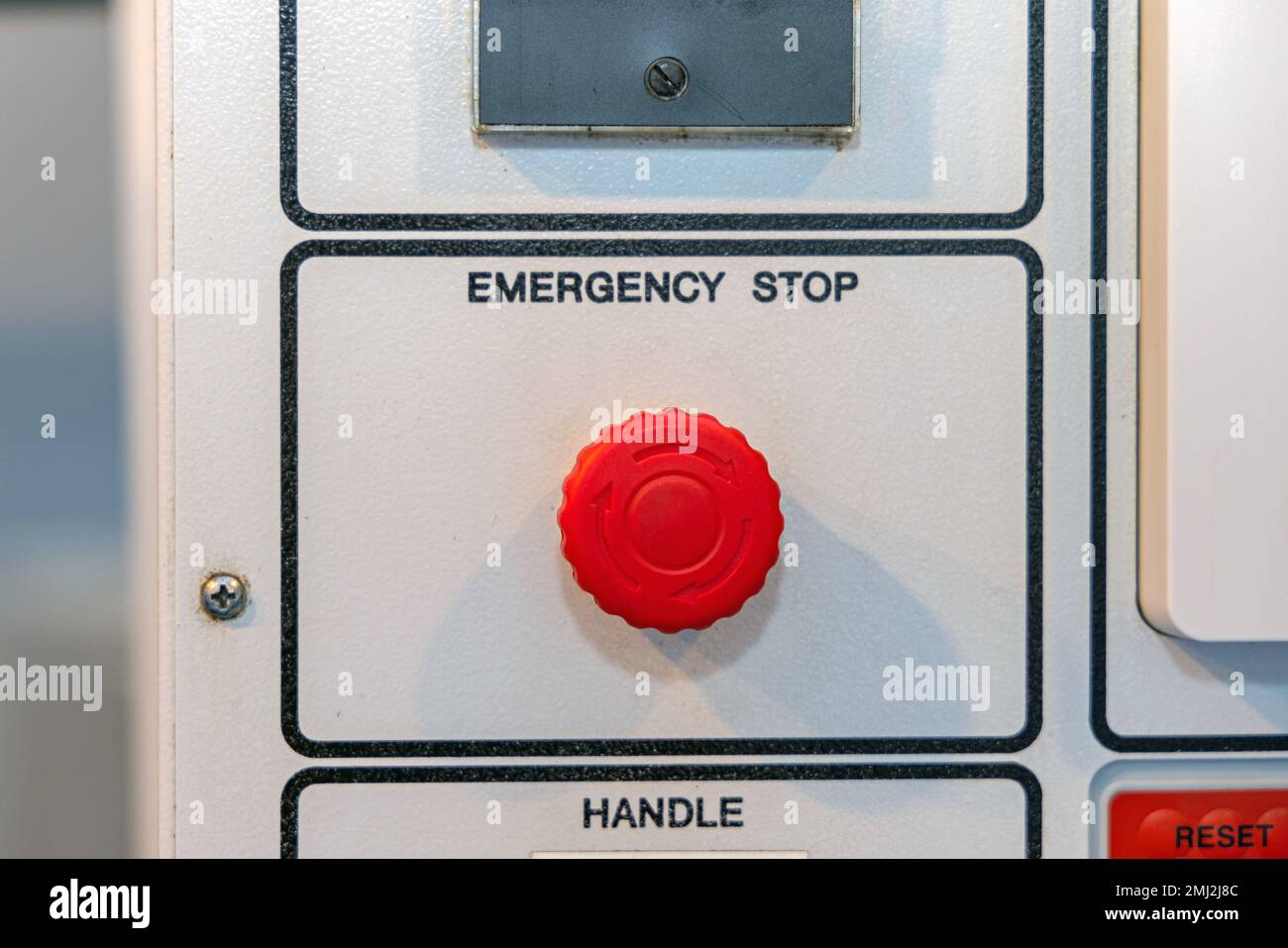 Large Red Emergency Stop Push Button at Machine Stock Photo