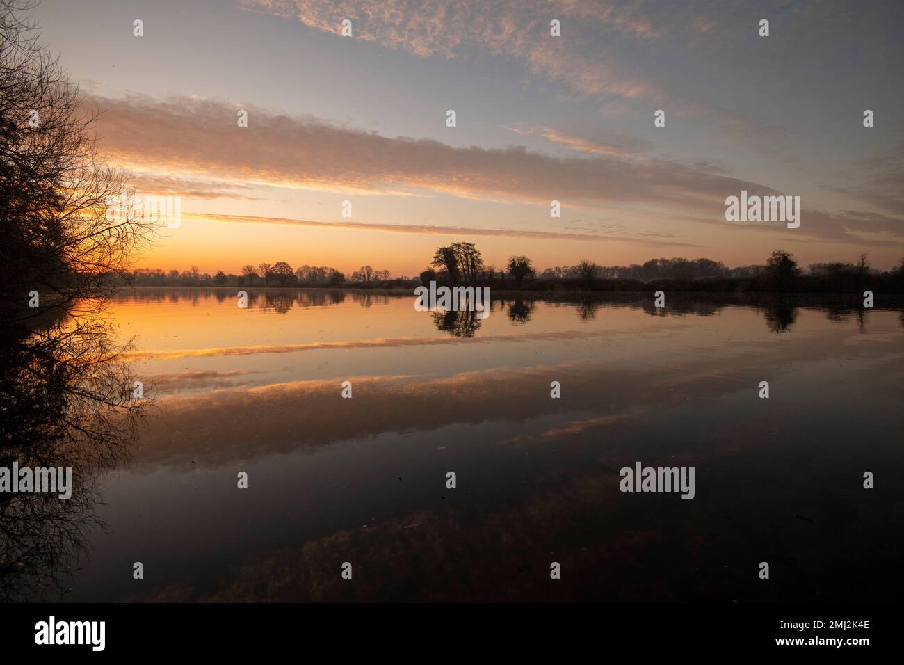 Sunrise reflections on the River Trent at Colwick Park, Nottingham Nottinghamshire England UK