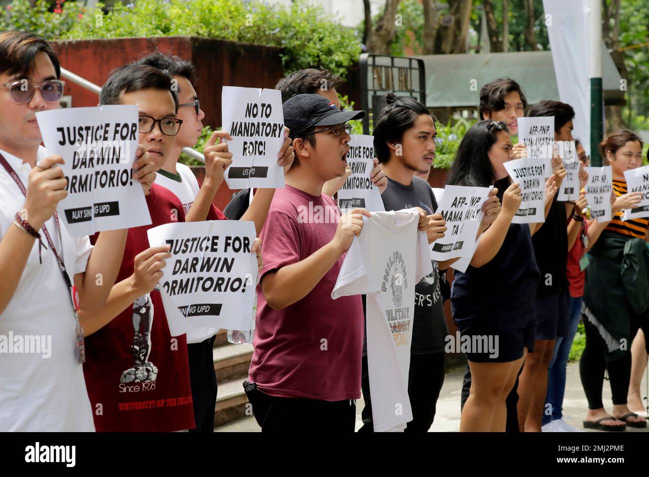 Students from the University of the Philippines shout slogans while ...