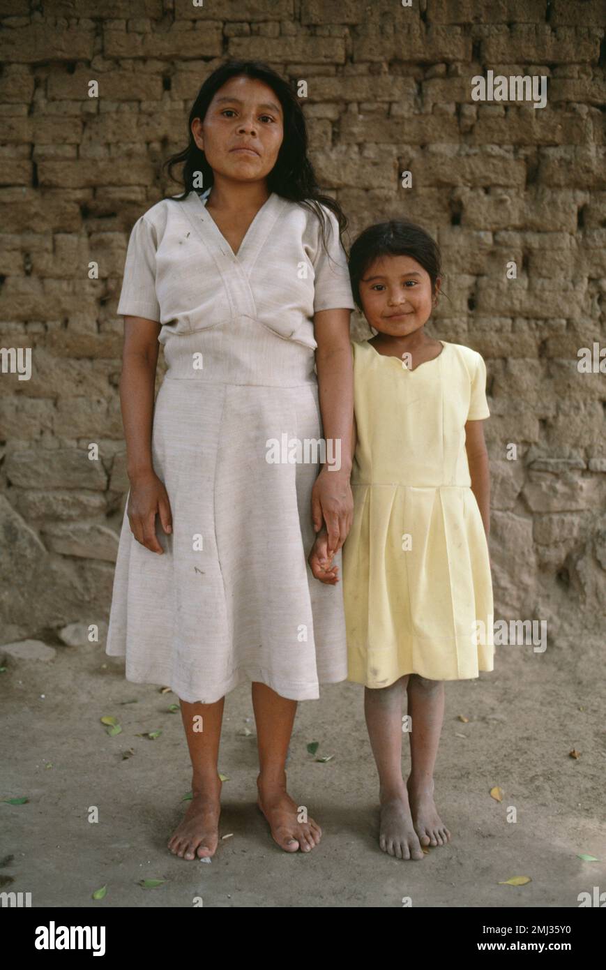A Mazatecan mother and daughter outside their home near the city of Oaxaca, Oaxaca, Mexico Stock Photo