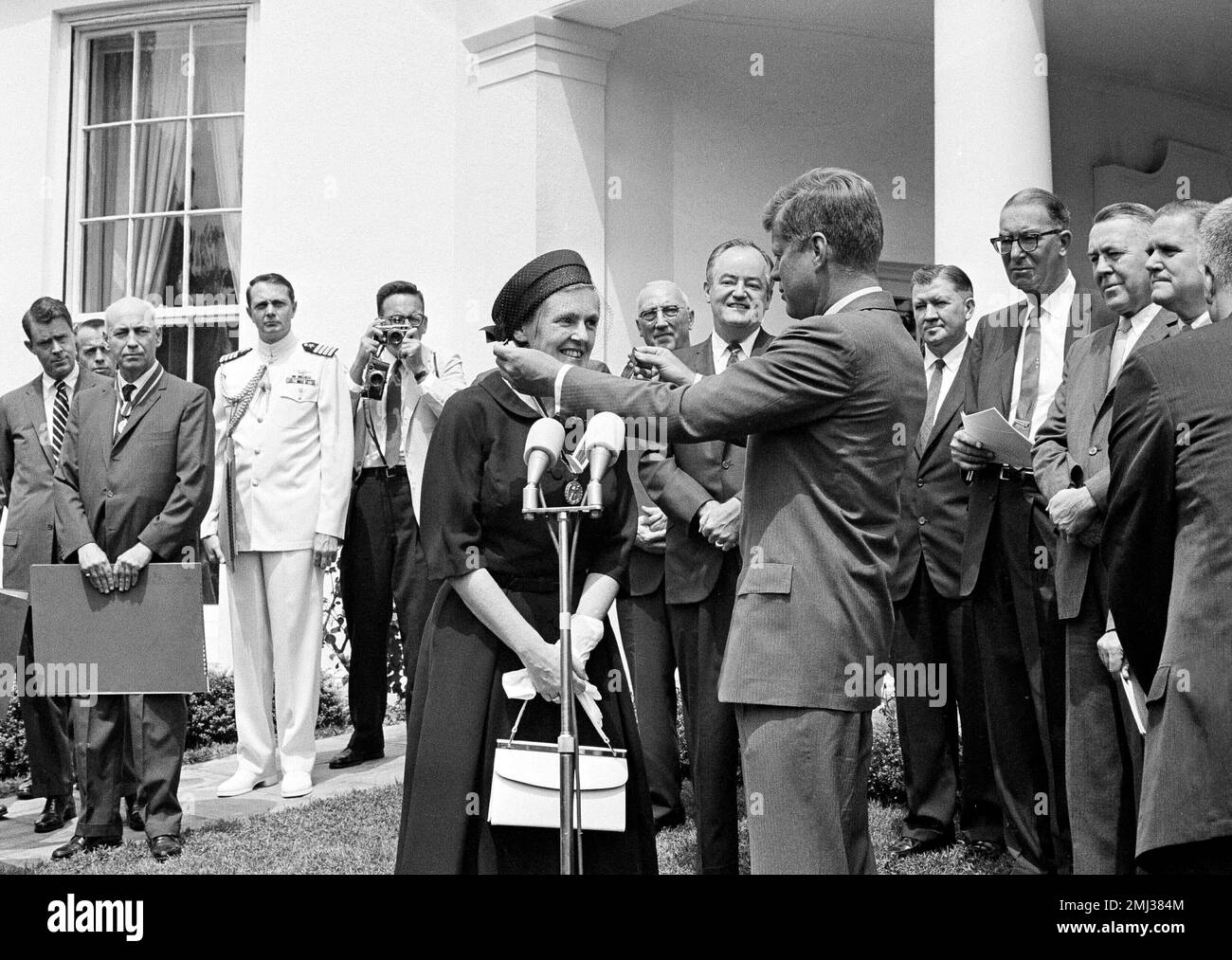 President Kennedy, center right, decorates Dr. Frances Oldham Kelsey