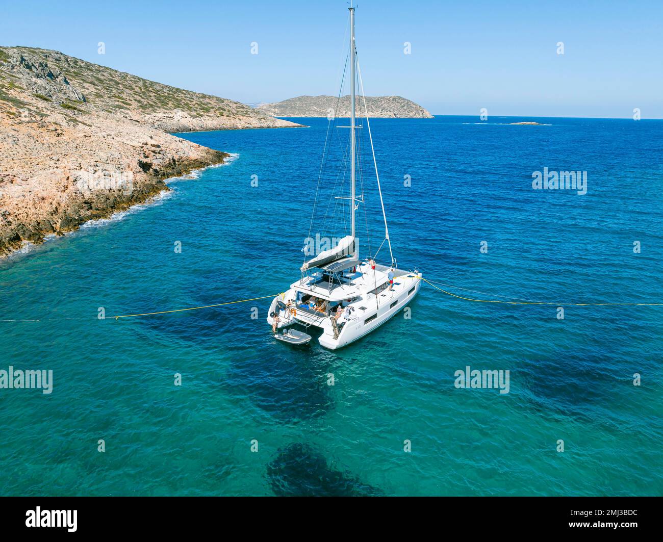 Sailing catamaran with shore lines, Greek island, South Aegean, Greece