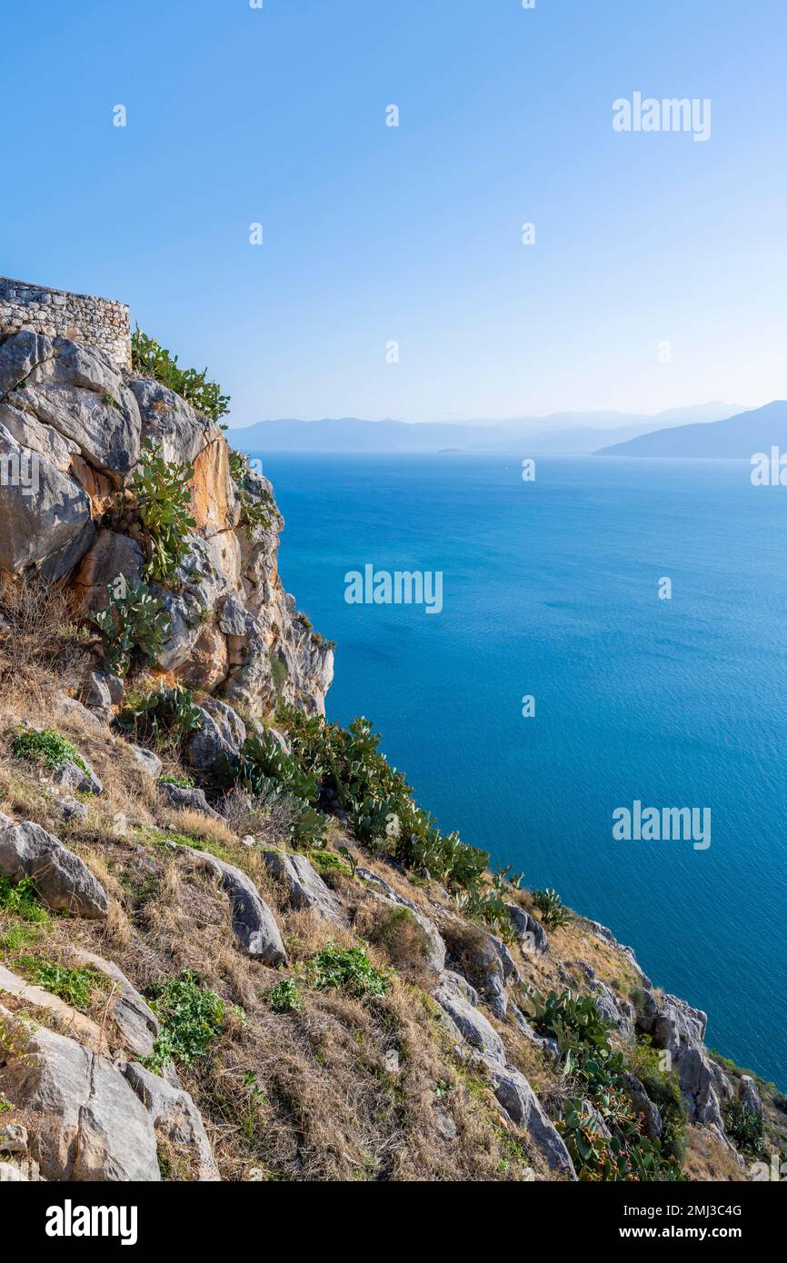 Steep cliff above the sea of Palamidi Fortress, Nafplio, Peloponnese, Greece Stock Photo