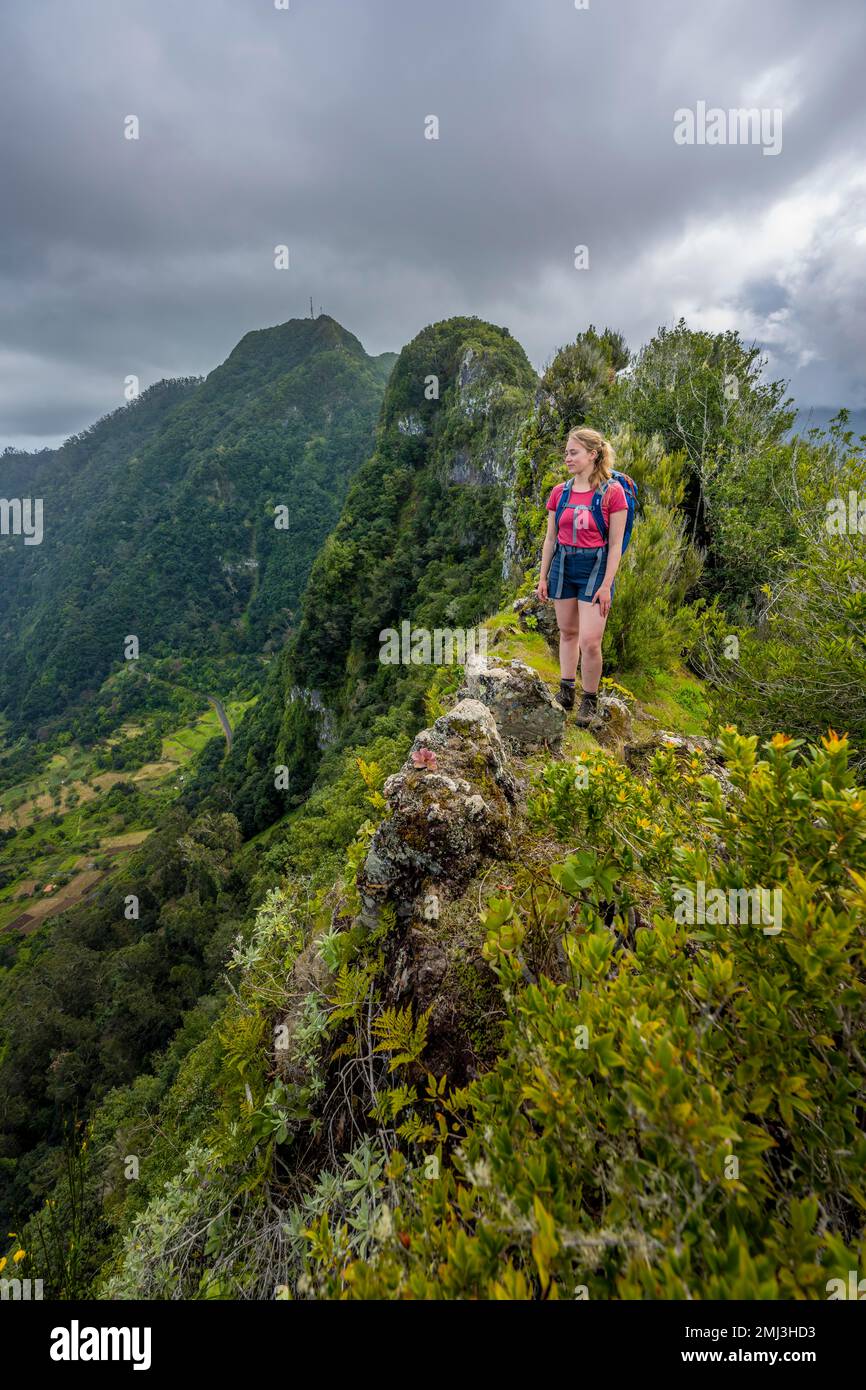 Hiker on the ridge of Pico do Alto, Madeira, Portugal Stock Photo