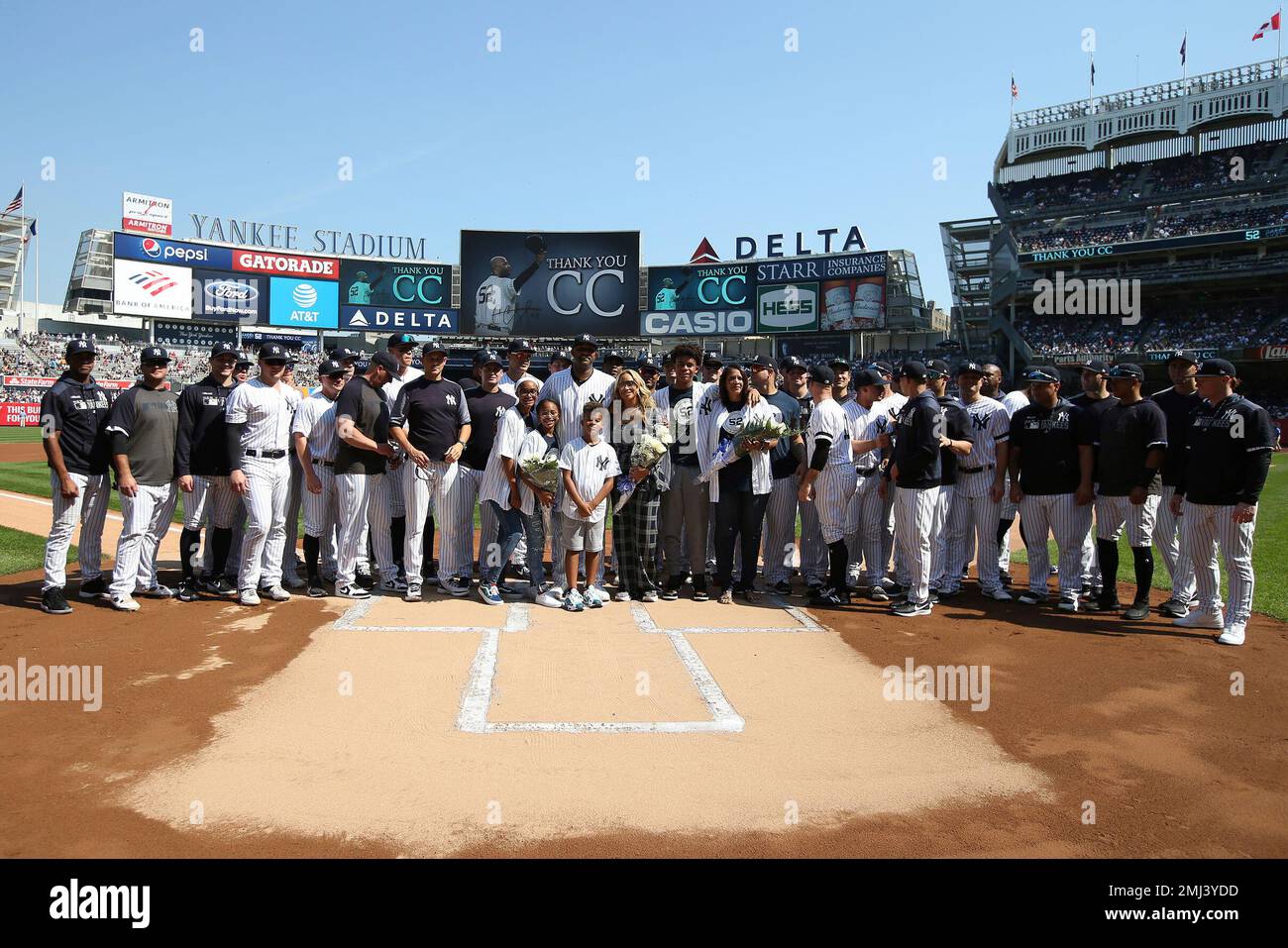 New York Yankees' CC Sabathia, center, surrounded by family and
