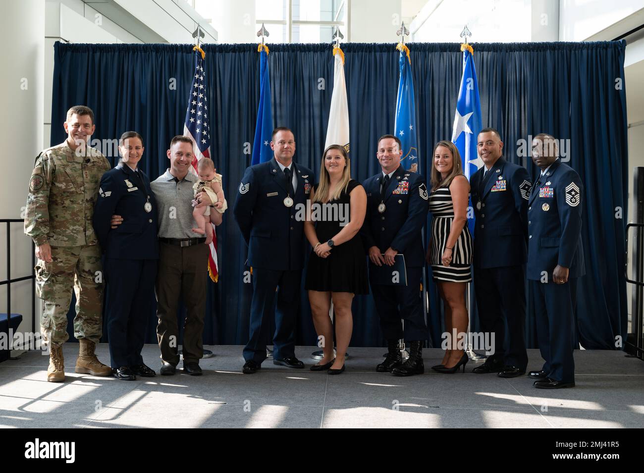 U.S. Air Force Lt. Gen. Michael A. Loh, left, director, Air National Guard (ANG), and Chief Master Sgt. Maurice L. Williams, right, command chief, ANG, pose for a photo with the 2022 Outstanding Airmen of the Year (OAY) honorees and their families during the OAY ceremony at Joint Base Andrews, Maryland, on Aug. 25, 2022. The four honorees were recognized as the ANG’s Airman, Non-commissioned Officer, Senior NCO, or First Sergeant of the Year during Focus on the Force Week 2022—an annual event hosted by the ANG command chief that highlights professional development and celebrates the accomplish Stock Photo