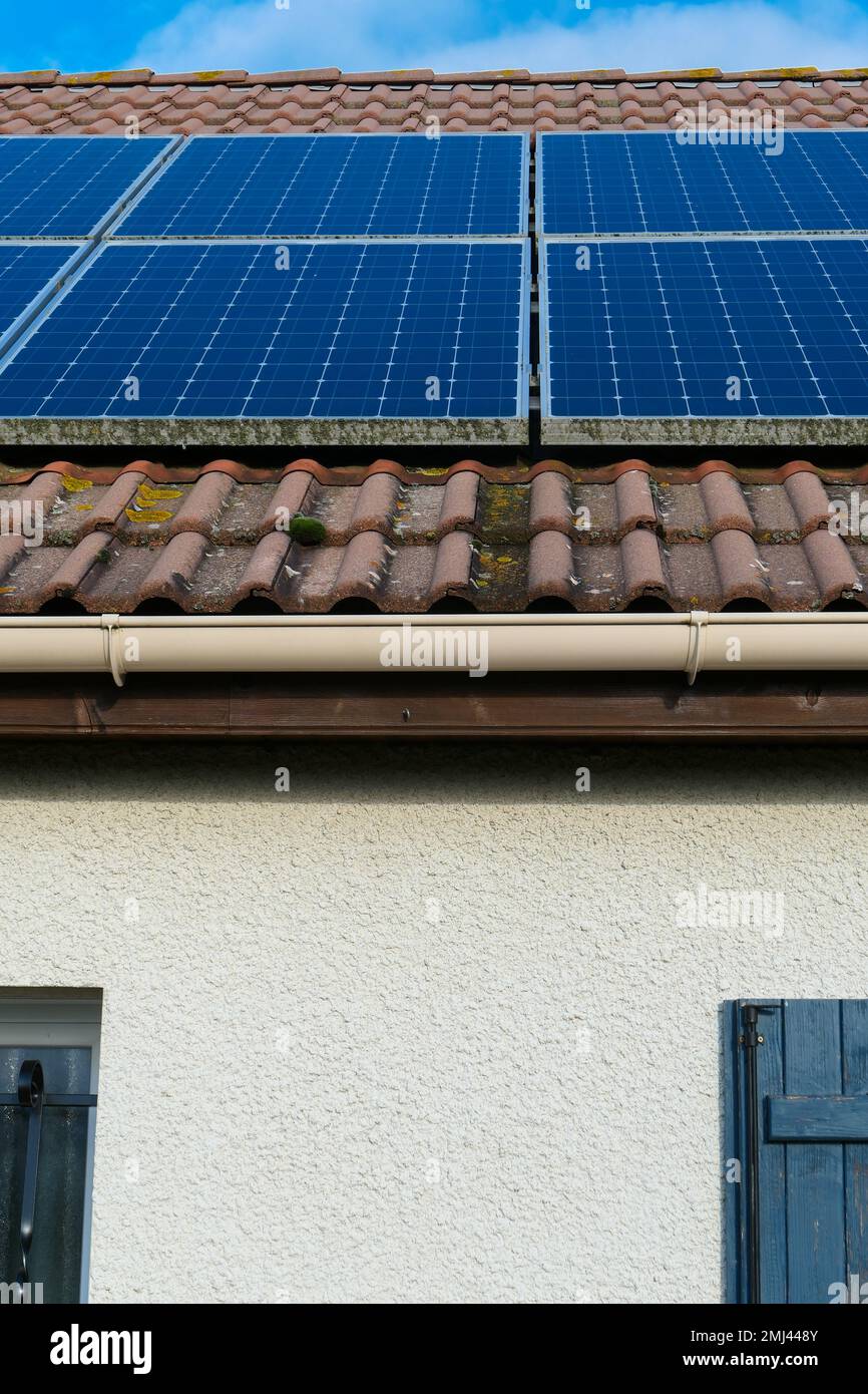 Photovoltaic panels installed on the roof of a house. Solar panels on a