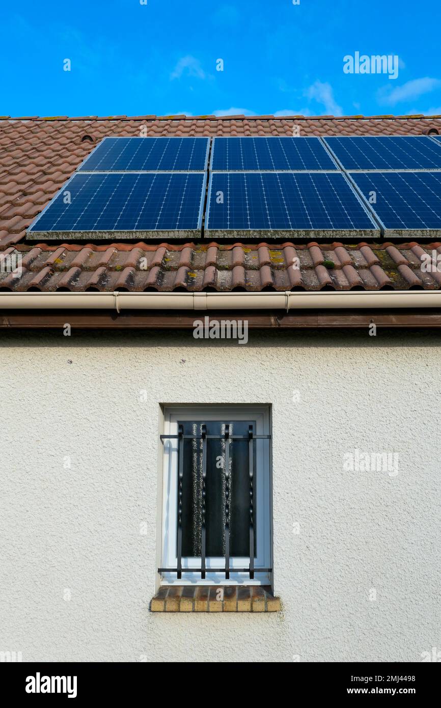 Photovoltaic panels installed on the roof of a house. Solar panels on a