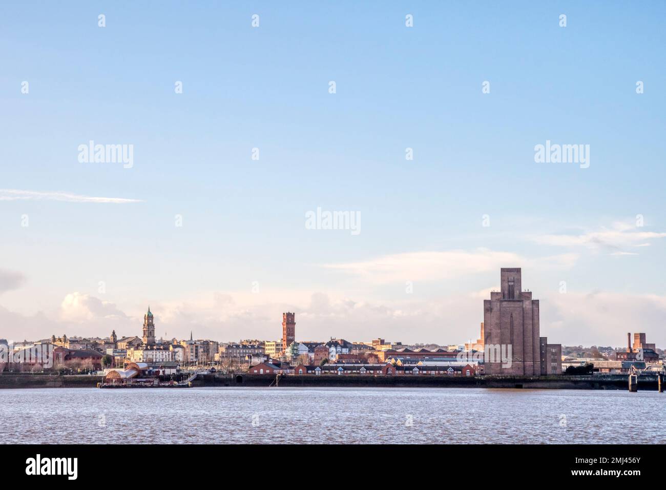 Birkenhead waterfront seen across the River Mersey from Liverpool.  Tall structure to the right is a ventilation shaft for the Queensway Mersey Tunnel Stock Photo