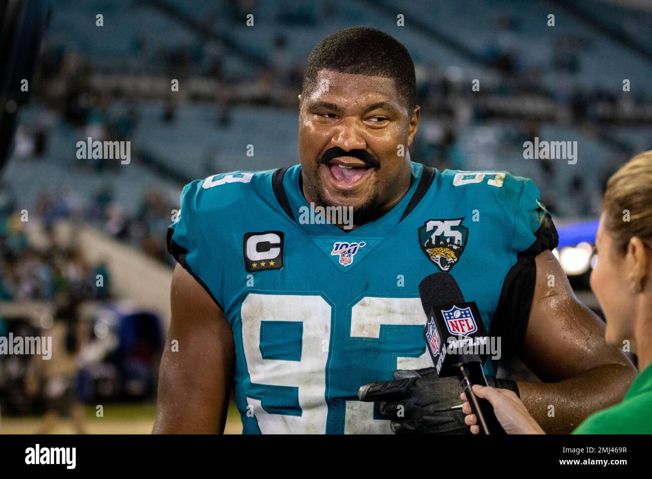 Wearing a fake stickon mustache, Jacksonville Jaguars defensive end