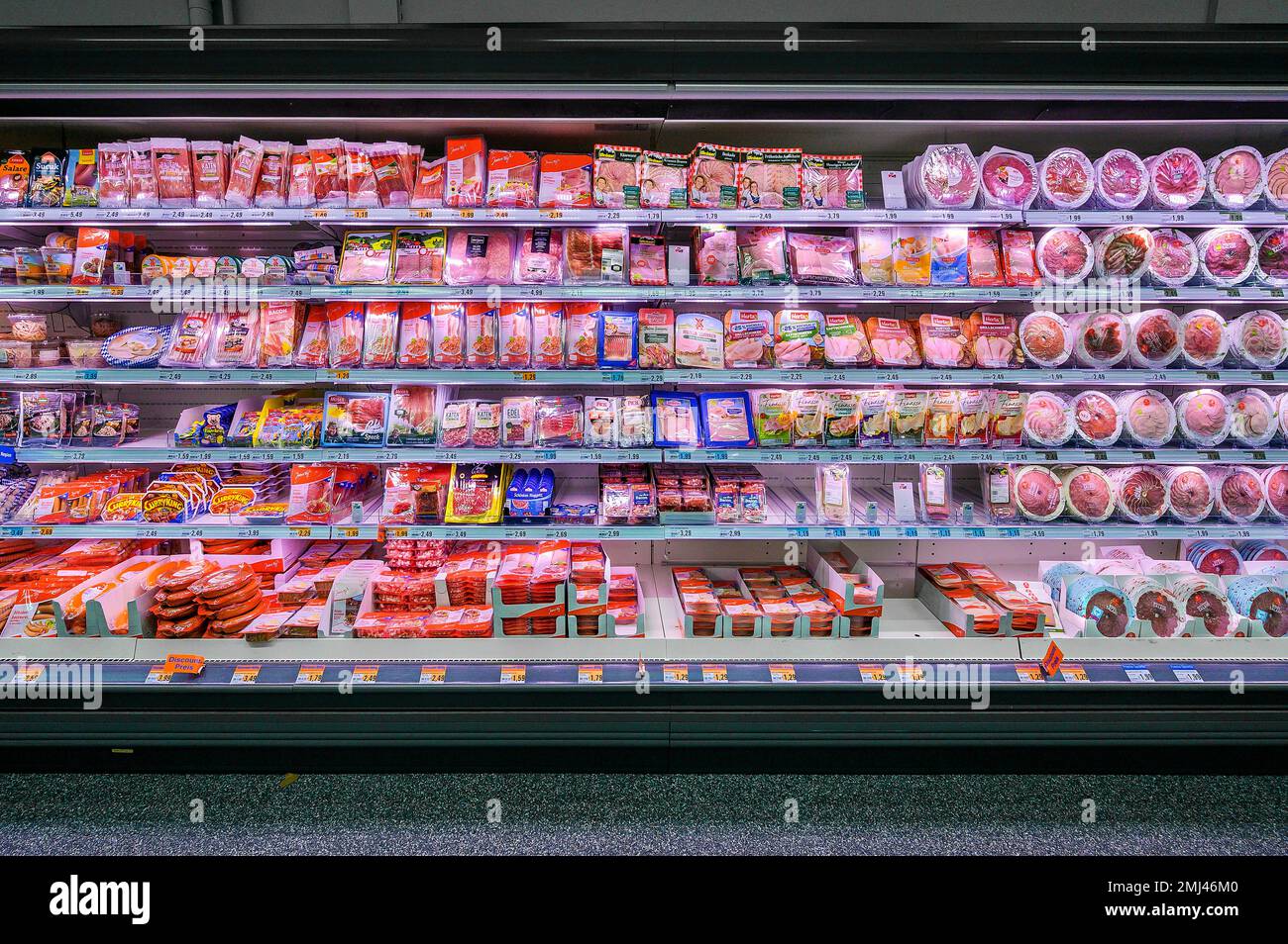 Shelf with sausages packed in plastic in a wholesale market, Bavaria, Germany Stock Photo Alamy