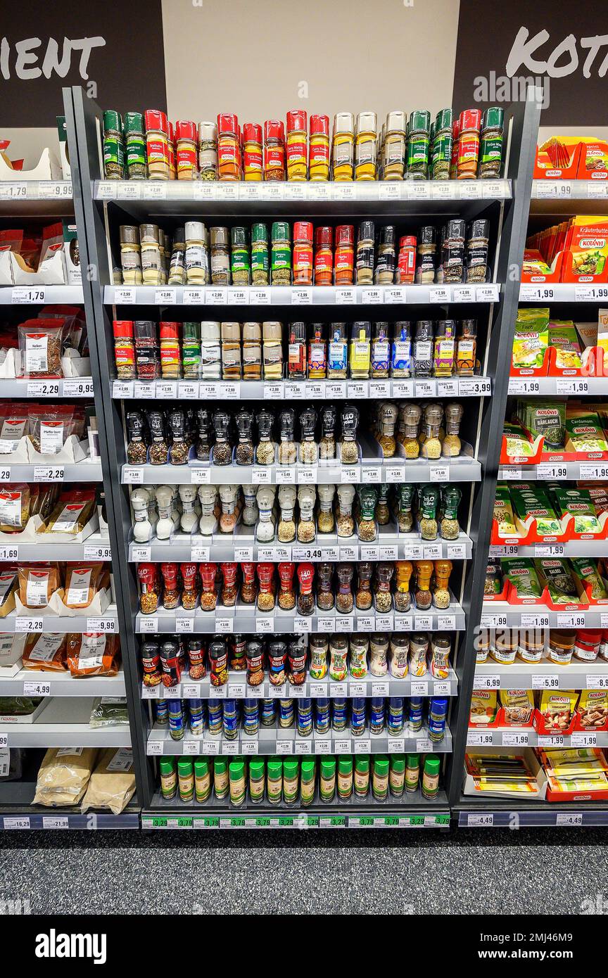 Shelf with spices in the wholesale market, Bavaria, Germany Stock Photo