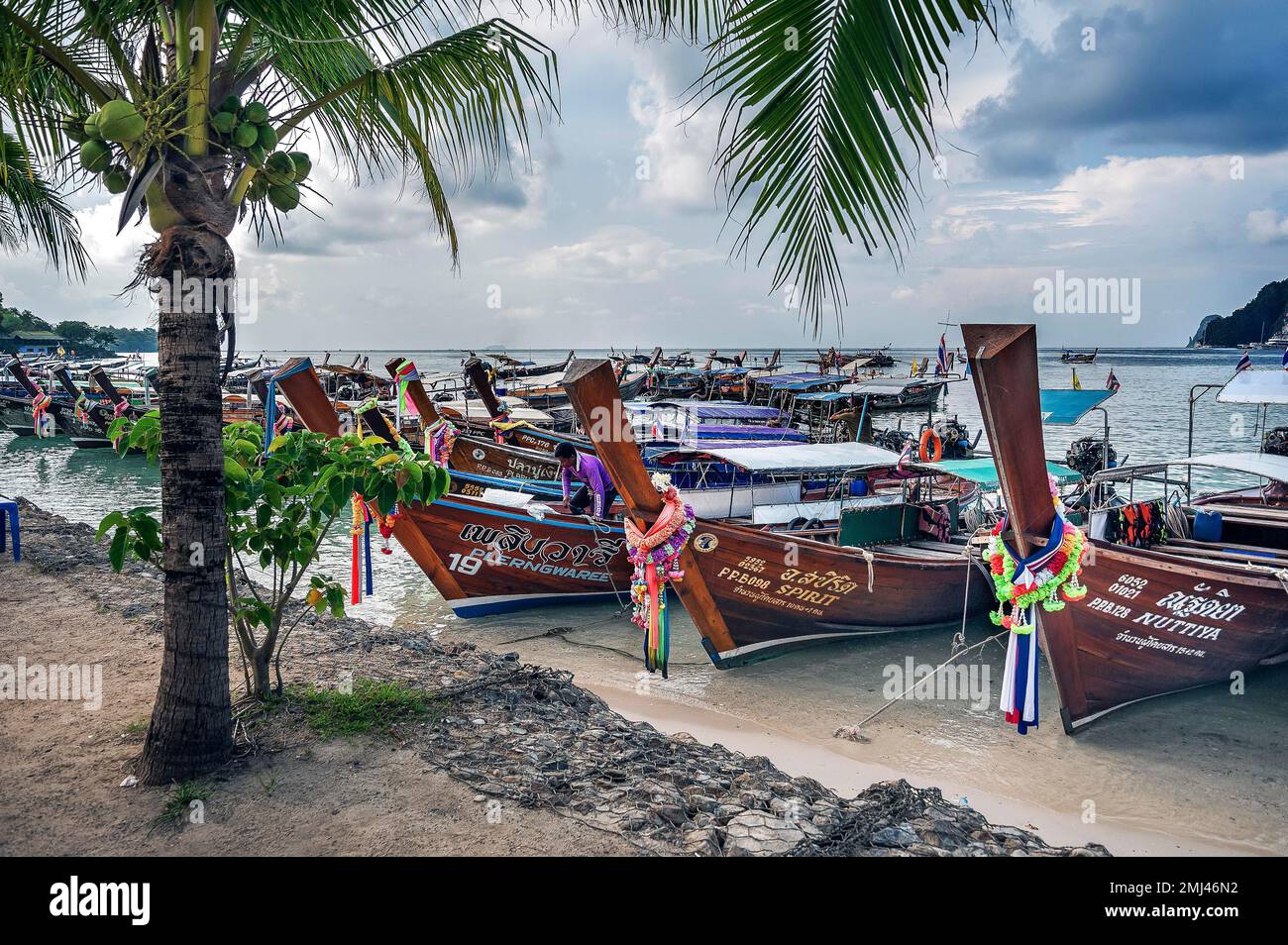 Tourist boats, longtail boats on Ko Phi Phi island, Phuket, Thailand Stock Photo