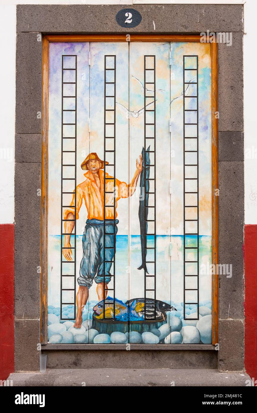 Mural, Colourful painted door, Fisherman with swordfish Espada, Funchal, Madeira, Portugal Stock Photo
