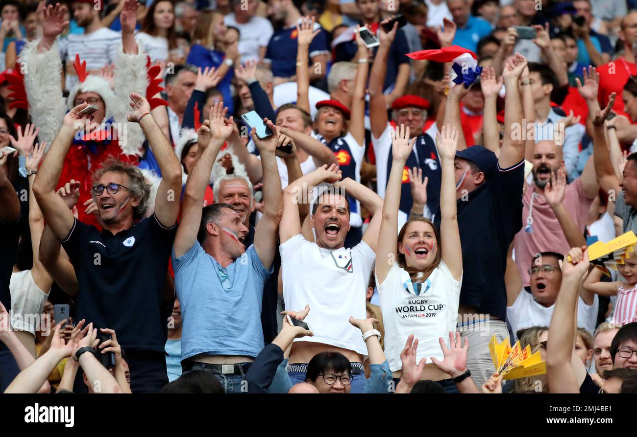 Spectators wave ahead of the Rugby World Cup Pool C game at Tokyo ...