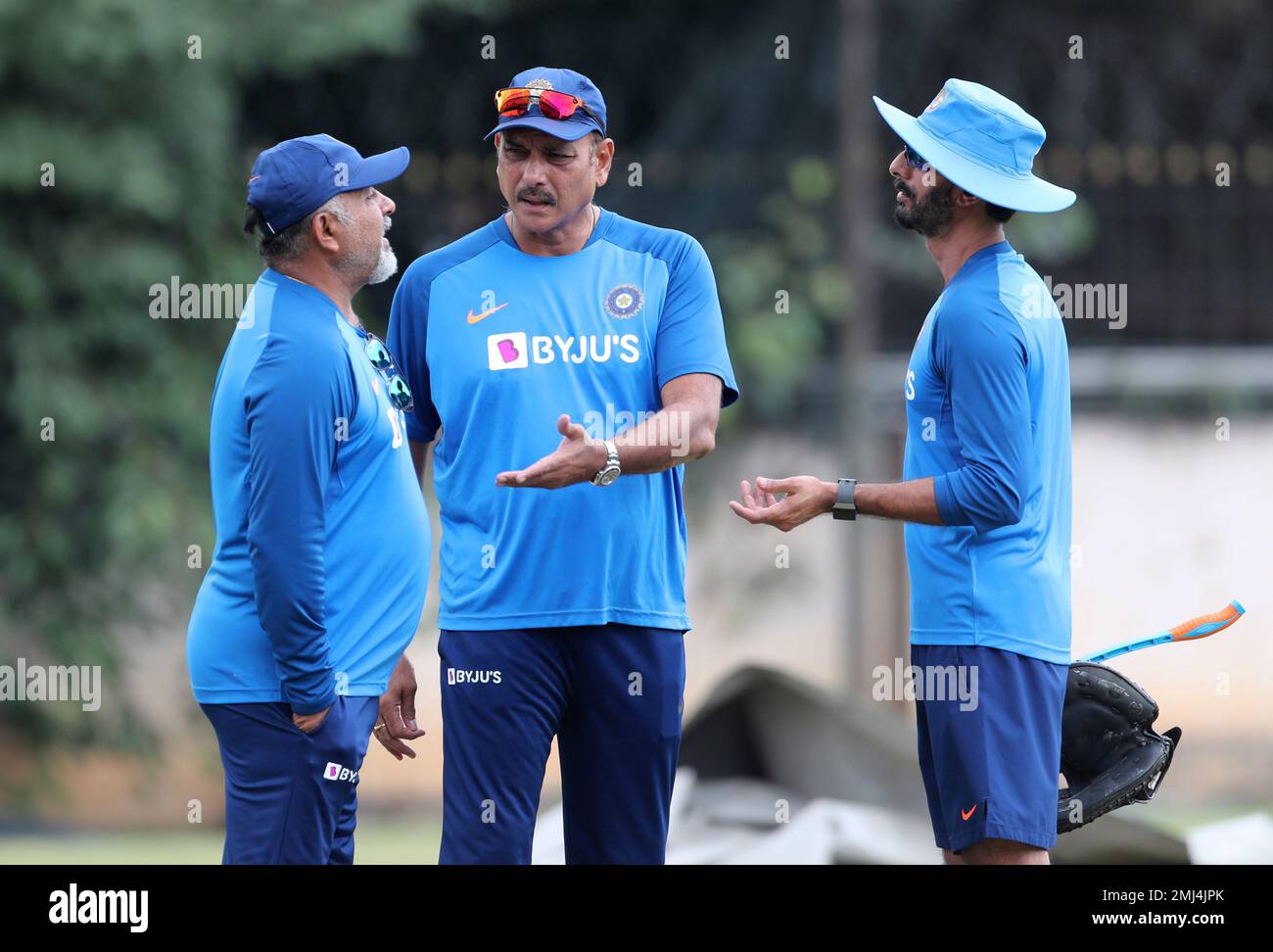 Indias bowling coach Bharat Arun, left, head coach Ravi Shastri, center, and batting coach Vikram Rathore interact with each other during a training session ahead of their last T20 cricket match against