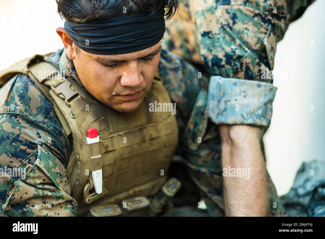 U.S. Navy Hospital Corpsman 3rd Class Dylan Sillero with 1st Battalion, 4th Marines, 1st Marine Division, draws blood as part of Valkyrie training from a simulated casualty during an Expeditionary Medical Integration Course (EMIC) on Marine Corps Base Camp Pendleton, California, Aug. 25, 2022. This is the third iteration of EMIC which validates the Marines of 1st Battalion, 4th Marines ability to provide a higher level of health service support capability in any operational environment. Stock Photo