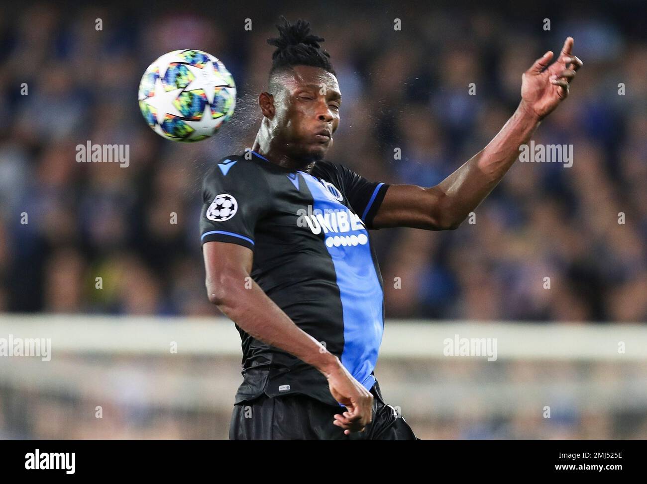 Brugge s David Okereke heads the ball during the Champions League