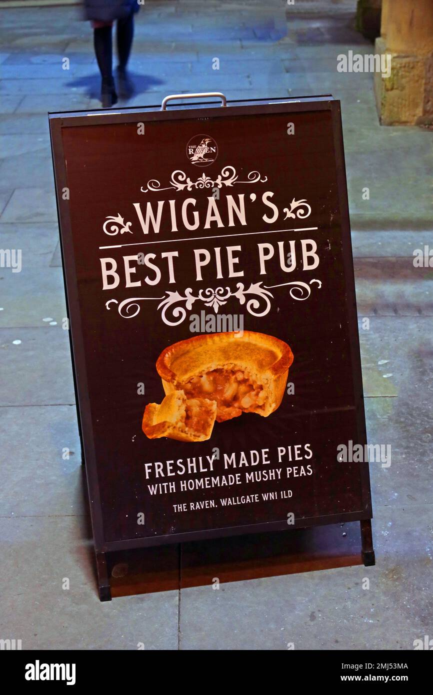 A-Board, advertising Wigans best pie pub, The Raven - Freshly made pies, with homemade mushy peas - Wallgate, Wigan, Lancs, England Stock Photo