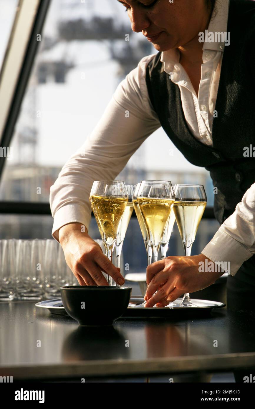 Bottles of Champagne cooling on ice, ready to be served by the waiter