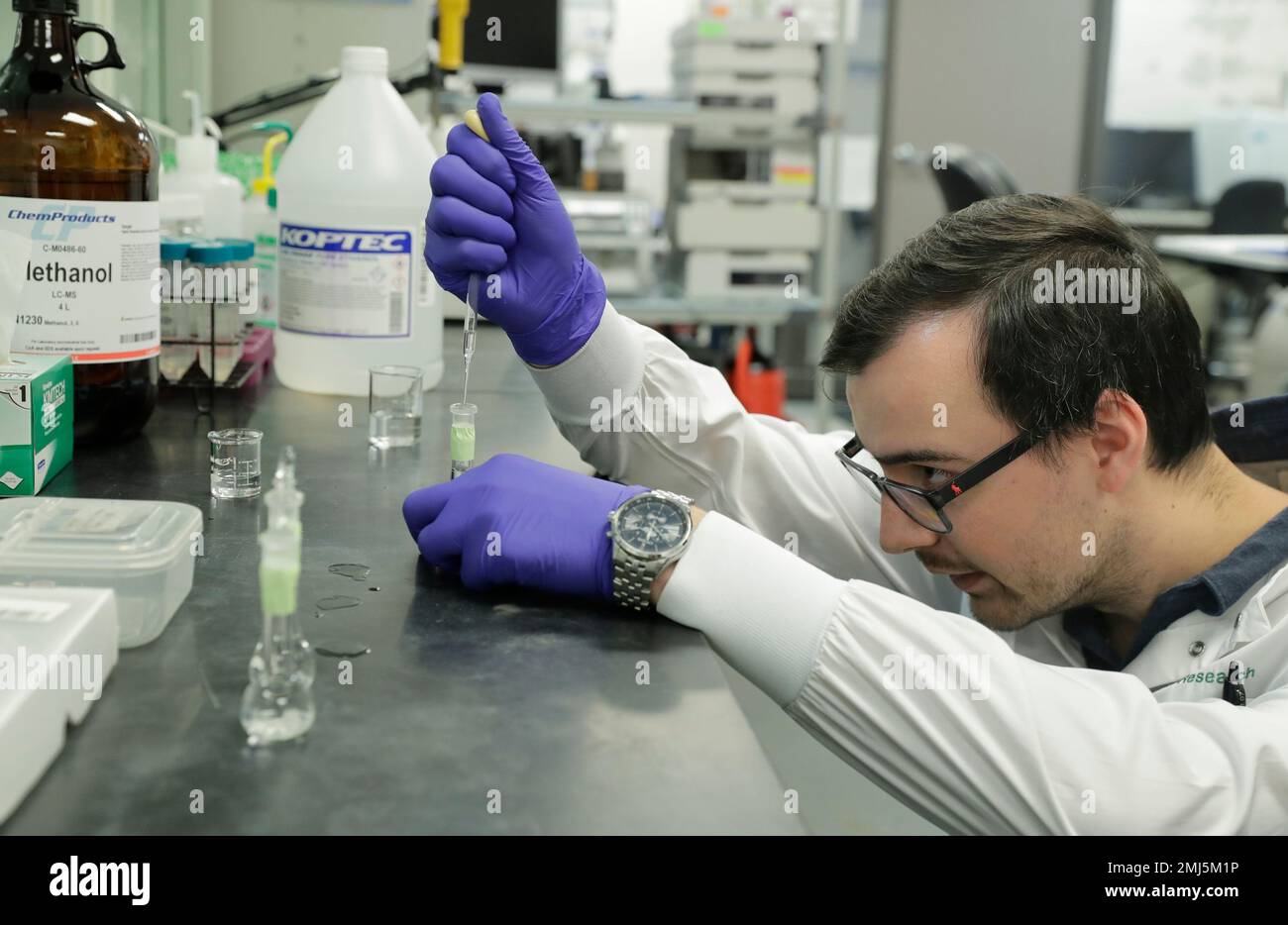 Pierce Prozy prepares a CBD vape oil test sample at Flora Research  Laboratories in Grants Pass, Ore., on July 19, 2019. The Associated Press  commissioned the lab to test 30 vape products