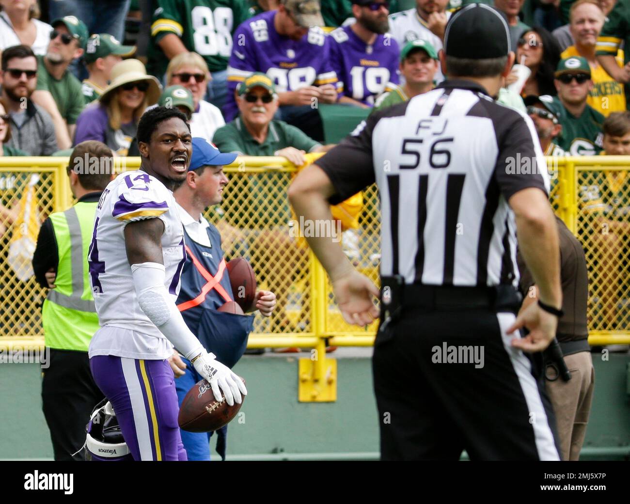 american football penalty removal of helmet Minnesota Vikings' Stefon Diggs reacts after being called for a penalty for  removing his helmet during the second half of an NFL football game against  the Green Bay Packers Sunday, Sept. 15,