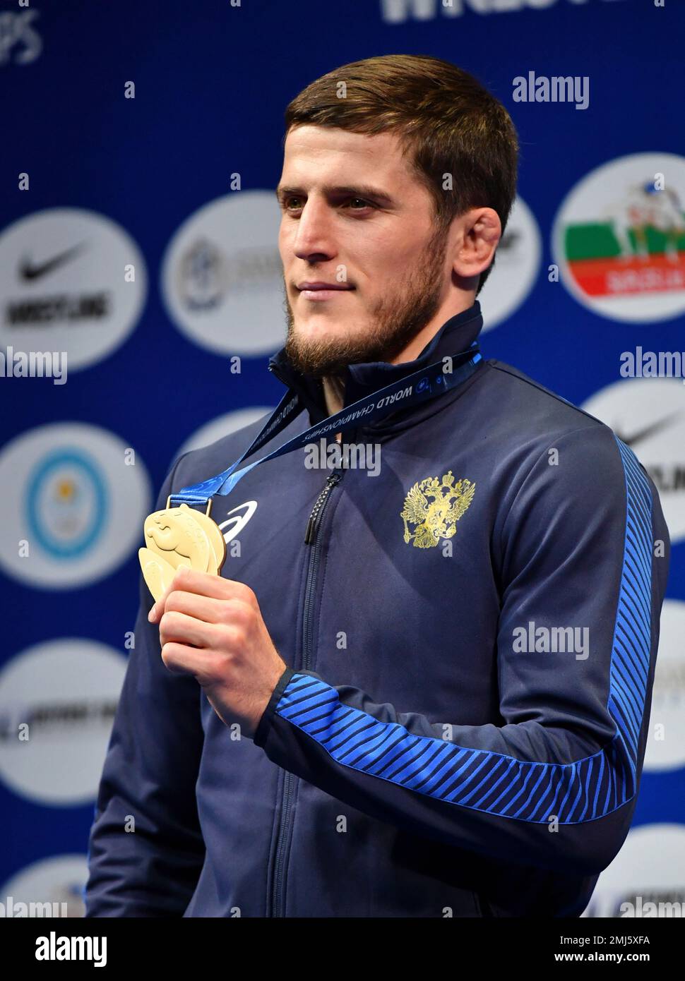 abuiazid-mantsigov-of-russia-poses-with-the-gold-medal-he-won-in-the