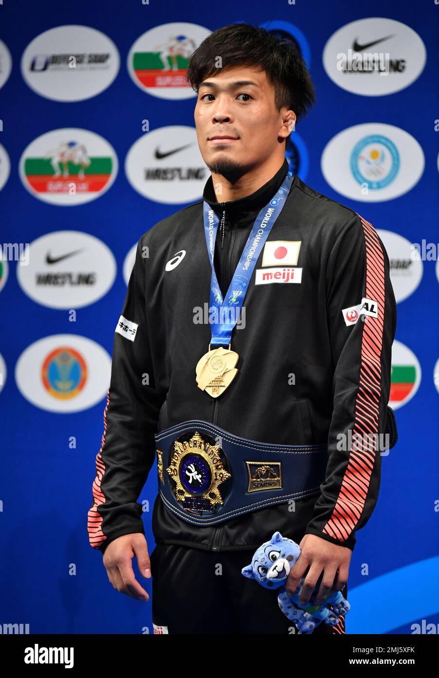 Gold medalist Shinobu Ota of Japan poses during a medal ceremony of the