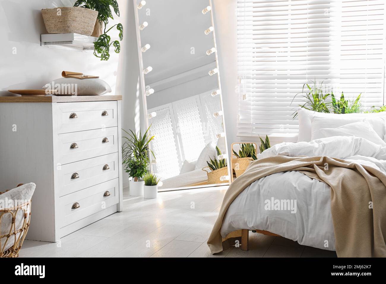 White chest of drawers in beautiful bedroom. Interior design Stock ...