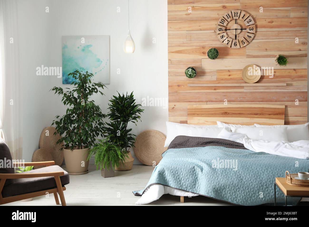 Stylish bedroom interior with green plants. Home design ideas Stock ...