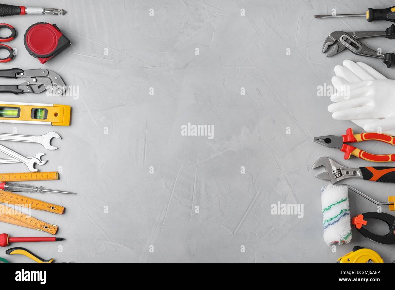 Flat lay composition with construction tools on light grey background ...
