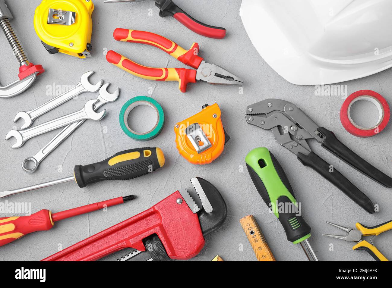 Flat lay composition with construction tools on light grey background ...