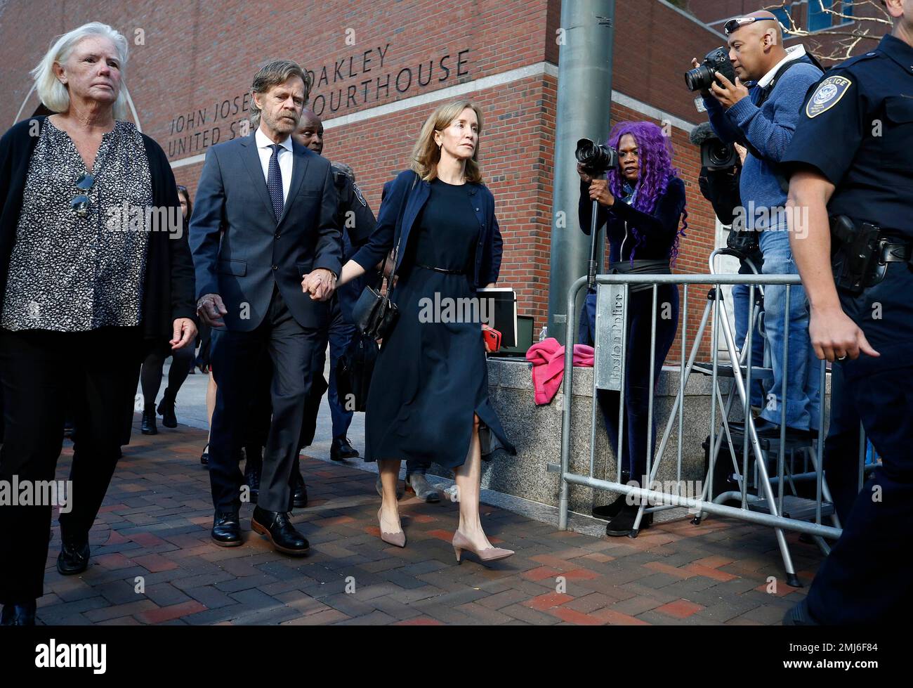 Felicity Huffman leaves federal court with her husband William H. Macy